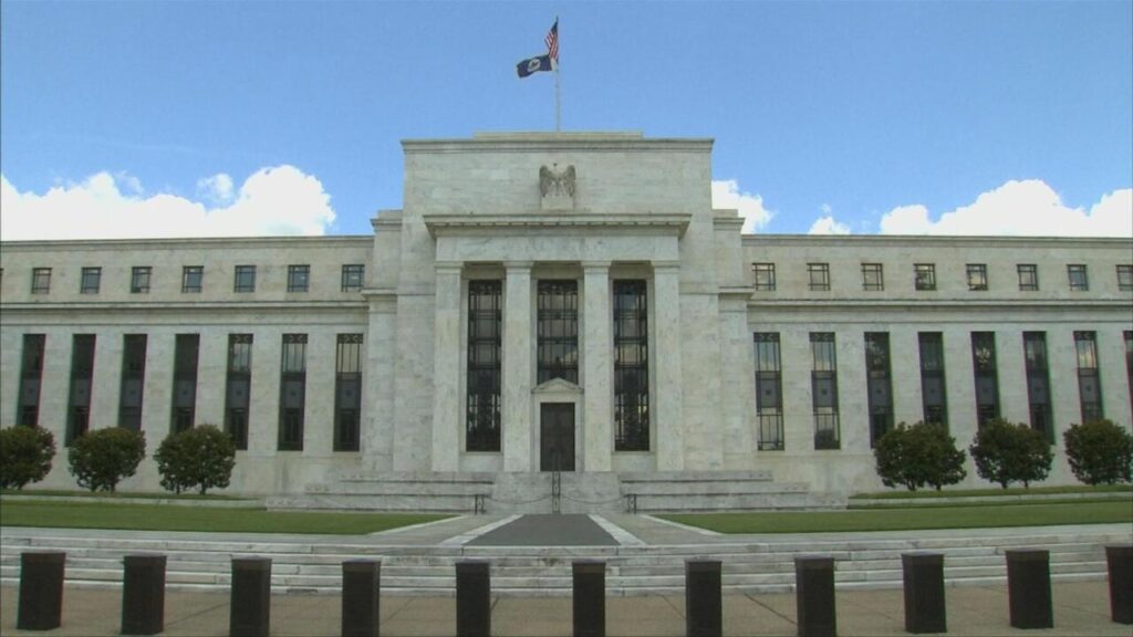 US Federal Reserve holds rates steady, but warns of inflation and slowing growth