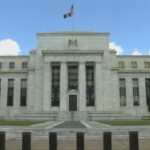 US Federal Reserve holds rates steady, but warns of inflation and slowing growth