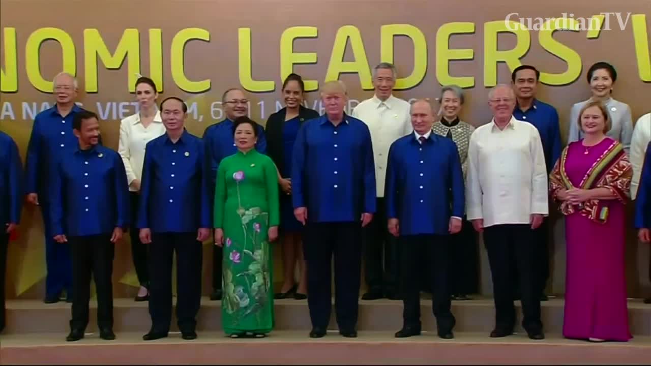 Trump, Putin shake hands during APEC family photo - GuardianTV