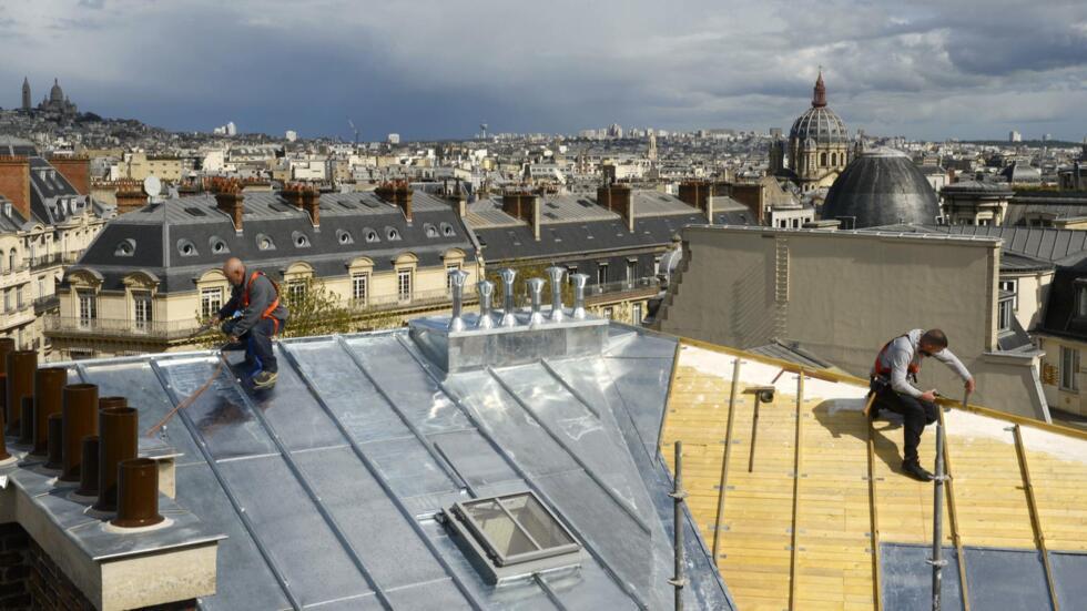 The rooftops of Paris with the zinc craftsmen of the sky