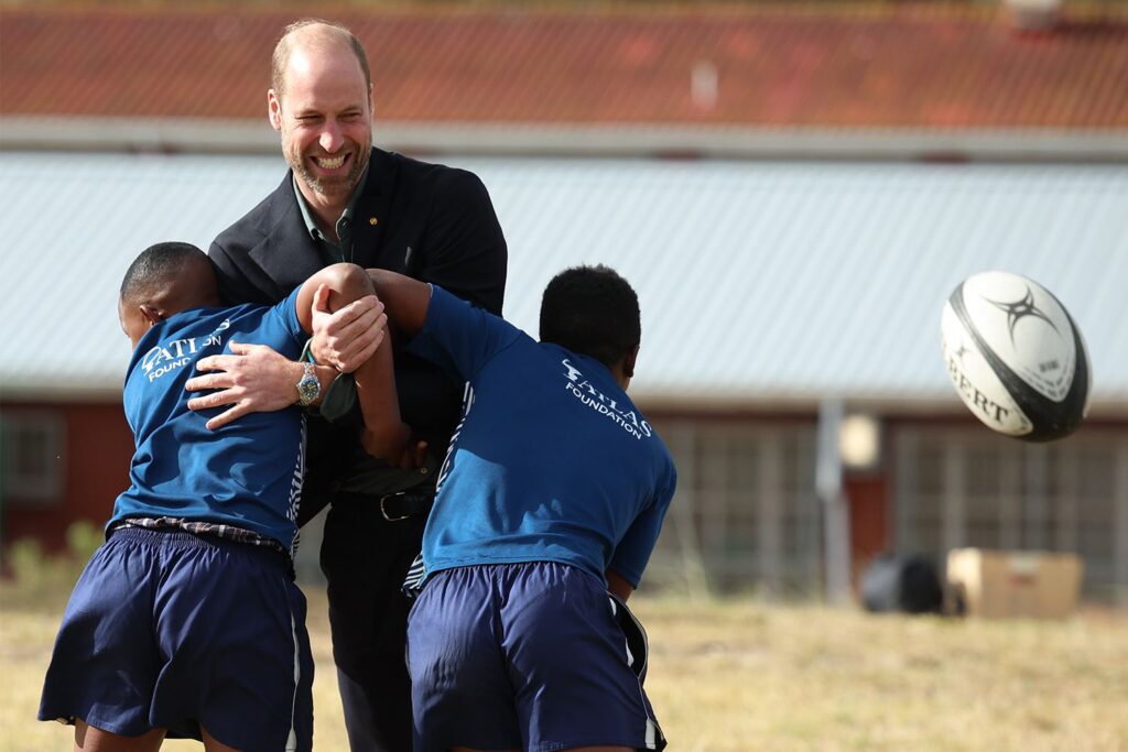 Britain's Prince William plays rugby with South African students