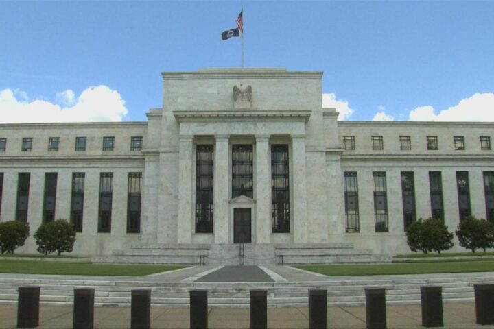 US Federal Reserve holds rates steady, but warns of inflation and slowing growth